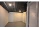 Finished basement with white walls and storage at 5250 Mountain Village Ct, Stone Mountain, GA 30083