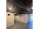 Unfinished basement with exposed pipes and beams at 5250 Mountain Village Ct, Stone Mountain, GA 30083