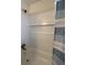 Updated bathroom with a tub and built-in shelving at 5250 Mountain Village Ct, Stone Mountain, GA 30083