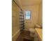 Bathroom with tub, toilet, and vanity, featuring wood-look floors at 5250 Mountain Village Ct, Stone Mountain, GA 30083