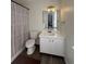 Bathroom with shower/tub combo, vanity, and updated flooring at 5250 Mountain Village Ct, Stone Mountain, GA 30083