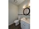 Clean bathroom with white vanity, toilet and tiled backsplash at 5250 Mountain Village Ct, Stone Mountain, GA 30083