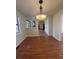 Bright dining room with hardwood floors and kitchen access at 5250 Mountain Village Ct, Stone Mountain, GA 30083