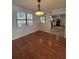 Spacious dining room with hardwood floors and view into kitchen at 5250 Mountain Village Ct, Stone Mountain, GA 30083