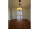 Sunlit dining room with hardwood floors and view of Gathering room at 5250 Mountain Village Ct, Stone Mountain, GA 30083