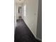 Clean hallway with carpet and access to bathroom at 5250 Mountain Village Ct, Stone Mountain, GA 30083