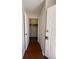 Bright hallway with coat closet and hardwood floors at 5250 Mountain Village Ct, Stone Mountain, GA 30083