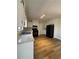 Bright kitchen with white cabinets and laminate flooring at 5250 Mountain Village Ct, Stone Mountain, GA 30083