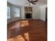 Living room with hardwood floors, fireplace and large windows at 5250 Mountain Village Ct, Stone Mountain, GA 30083