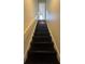 Interior view of a black staircase leading to upper levels at 5250 Mountain Village Ct, Stone Mountain, GA 30083