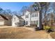 Two-story house with gray siding, white trim, and a two-car garage at 11145 Glenbarr Dr, Johns Creek, GA 30097