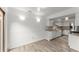 Bright dining room featuring white cabinetry, stainless steel appliances, and hardwood flooring at 154 Great Oaks Ln, Roswell, GA 30075