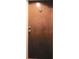 Apartment door with simple wood finish at 32 Peachtree Nw St # 1601, Atlanta, GA 30303