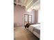 Spacious bedroom with exposed beams and double doors at 32 Peachtree Nw St # 1601, Atlanta, GA 30303