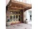 Building entrance with bronze canopy and doors at 32 Peachtree Nw St # 1601, Atlanta, GA 30303