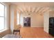 Bright dining area with hardwood floors and exposed beams at 32 Peachtree Nw St # 1601, Atlanta, GA 30303