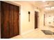 Building hallway with wood elevators and tile floors at 32 Peachtree Nw St # 1601, Atlanta, GA 30303
