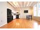 White kitchen with black appliances and hardwood floors at 32 Peachtree Nw St # 1601, Atlanta, GA 30303