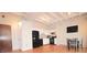 White kitchen with black appliances and hardwood floors at 32 Peachtree Nw St # 1601, Atlanta, GA 30303