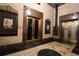 Refined entryway with brass doors and historical building markers at 32 Peachtree Nw St # 1601, Atlanta, GA 30303