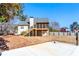 Home exterior with a large backyard, deck, and basketball court at 4901 Planters Walk, Douglasville, GA 30135