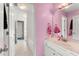 Pink bathroom with single vanity and tub at 4901 Planters Walk, Douglasville, GA 30135