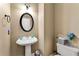 Small bathroom with pedestal sink and toilet at 4901 Planters Walk, Douglasville, GA 30135