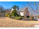 Side view of house showcasing landscaping and yard at 4901 Planters Walk, Douglasville, GA 30135