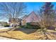 House with attached garage and mature trees in front at 4901 Planters Walk, Douglasville, GA 30135