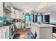 Spacious kitchen with white cabinets, marble island, and stainless steel appliances at 4901 Planters Walk, Douglasville, GA 30135