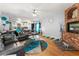 Bright living room with gray sectional sofa and view into kitchen area at 4901 Planters Walk, Douglasville, GA 30135