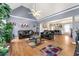 Open concept living room with hardwood floors and access to dining area at 4901 Planters Walk, Douglasville, GA 30135