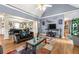 Living room with vaulted ceiling, hardwood floors, and a fireplace at 4901 Planters Walk, Douglasville, GA 30135