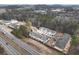 A serene aerial perspective capturing charming townhomes nestled near a highway and expansive green spaces at 1616 Ruskin Way, Marietta, GA 30062