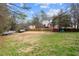 Spacious backyard with a deck, lawn, and mature trees at 1867 Falcon Wood Ne Dr, Marietta, GA 30066