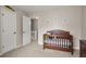 Cozy room featuring a crib, neutral walls, and artwork at 1867 Falcon Wood Ne Dr, Marietta, GA 30066