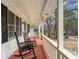 Inviting front porch with classic rocking chairs, perfect for relaxing and enjoying the outdoors at 1867 Falcon Wood Ne Dr, Marietta, GA 30066