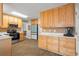 Bright kitchen features wood cabinets, stainless steel appliances, and wood-look tile flooring at 1867 Falcon Wood Ne Dr, Marietta, GA 30066