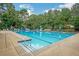 Community swimming pool featuring lounge chairs and umbrellas for relaxation at 1867 Falcon Wood Ne Dr, Marietta, GA 30066