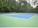 Outdoor tennis courts for recreational enjoyment in a fenced-in area at 1867 Falcon Wood Ne Dr, Marietta, GA 30066