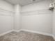 Large walk-in closet with wire shelving and neutral carpeting at 4160 Cavalier Way, Duluth, GA 30097