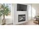 Modern fireplace with shiplap wall and built-in TV at 4160 Cavalier Way, Duluth, GA 30097