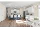 Modern kitchen with white cabinets, island, and breakfast area at 4160 Cavalier Way, Duluth, GA 30097