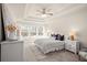 Main bedroom with a ceiling fan and large windows at 4160 Cavalier Way, Duluth, GA 30097