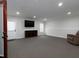 Finished basement with neutral carpet, recessed lighting, and entertainment area, offering versatile living space at 4417 Green Pastures Way, Ellenwood, GA 30294