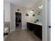 Bathroom featuring double vanity with and decor and walk-in closet at 4417 Green Pastures Way, Ellenwood, GA 30294