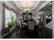 Formal dining room with a chandelier, crown molding, and elegant furnishings at 4417 Green Pastures Way, Ellenwood, GA 30294