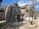 View of the brick home with an attached two-car garage and well maintained landscaping at 4417 Green Pastures Way, Ellenwood, GA 30294