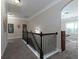 Upstairs hallway offering views of the home's interior and a bonus room at the end at 4417 Green Pastures Way, Ellenwood, GA 30294