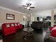 Open-concept living room features hardwood floors and seamless transition to the dining area at 4417 Green Pastures Way, Ellenwood, GA 30294